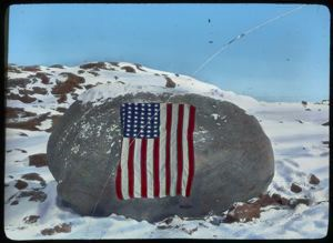 Image: Flag on Memorial Boulder at Cape Sabine